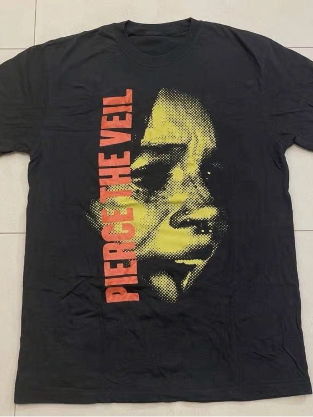 Resident Eviel black Short-Sleeve Tee with Yellow Face Graphic and Red Vertical